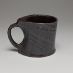 black mug in oxidation (left)