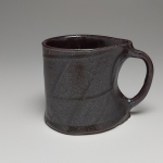 black mug in oxidation (right)