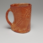 shino mug in oxidation (left)